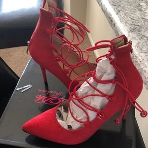 Red suede strap pumps